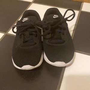Black and white Nike sneakers for young boys